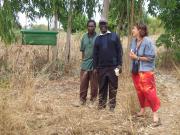 Margaret(Zikomo) and Winston (PFL) with head of local coop infront of beehive.