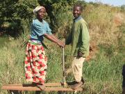 Mr. Marikita and his wife using their treadle pump.