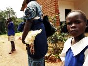 Maureen gives a chicken to her teacher at end of term.